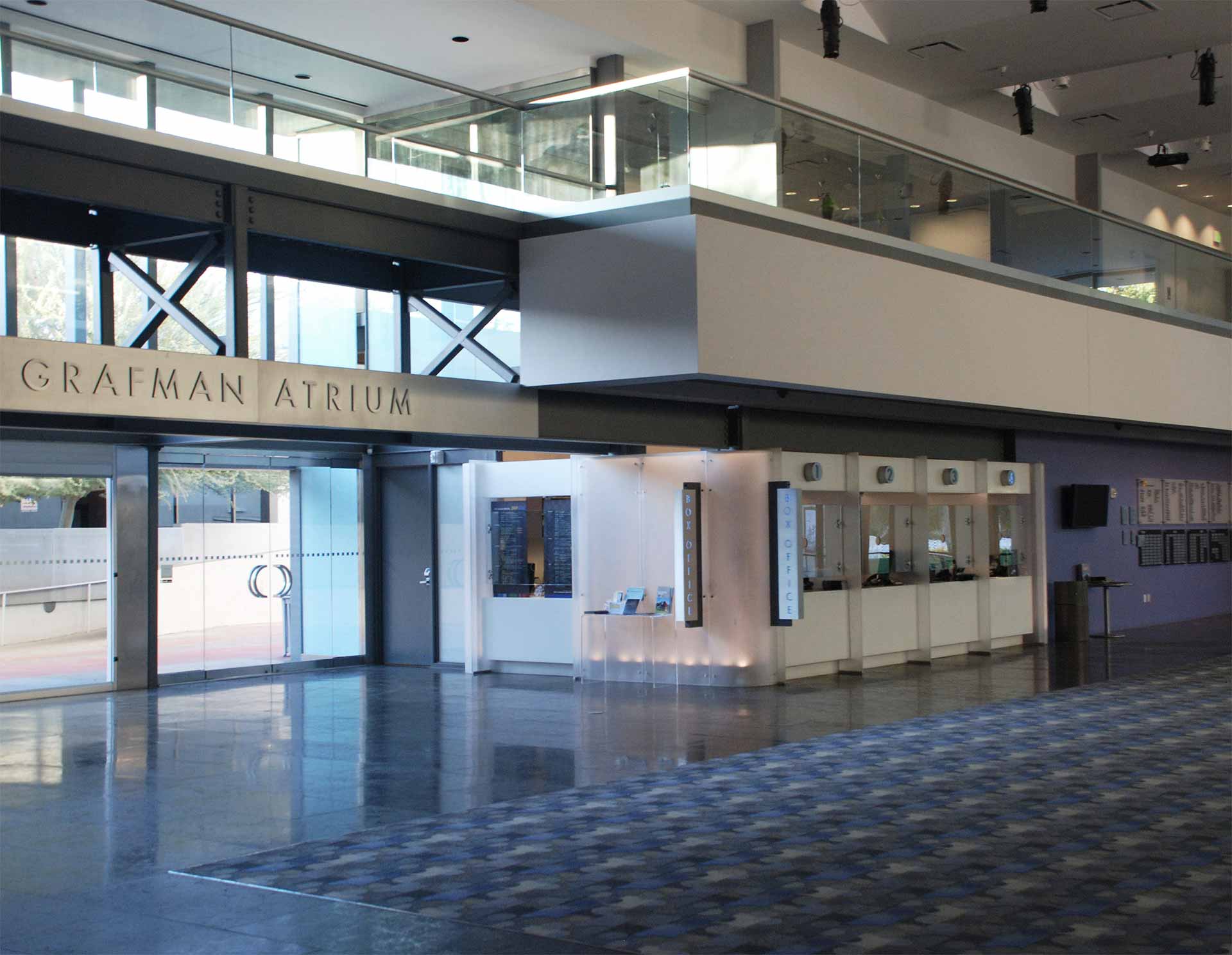 Internally lit translucent resin walls illuminate the box office.