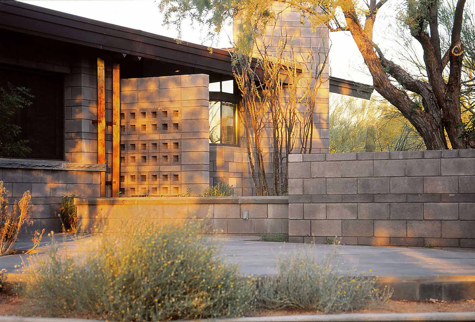 Patio with concrete masonry and copper downspout details.